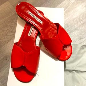 WORN ONCE MANOLO BLAHNICK RED PATENT LEATHER SLIDES.
